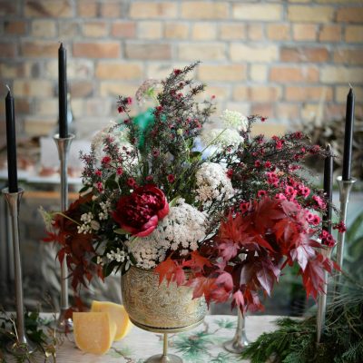 Arrangement of flowers and candles for wedding celebration