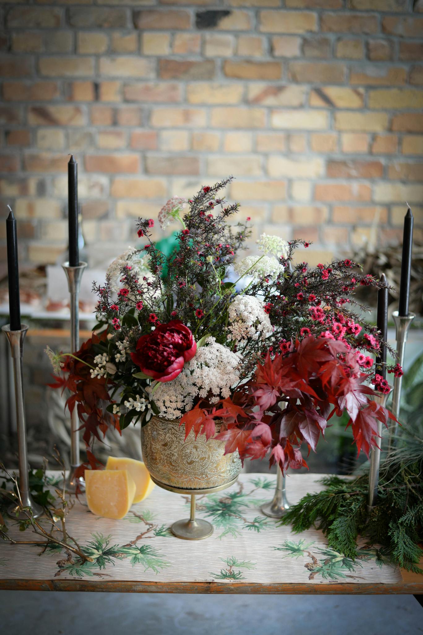 Arrangement of flowers and candles for wedding celebration