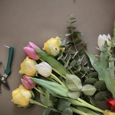 Colorful flowers bouquet near pruning scissors